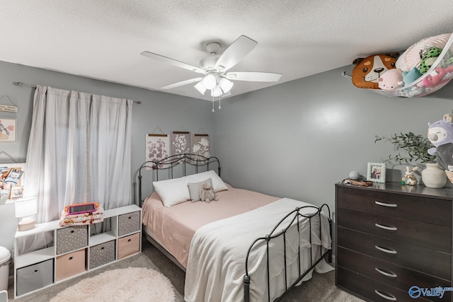 43 Terry Ln, Trinity, AL 35673 - bedroom with carpet floors, ceiling fan, and a textured ceiling