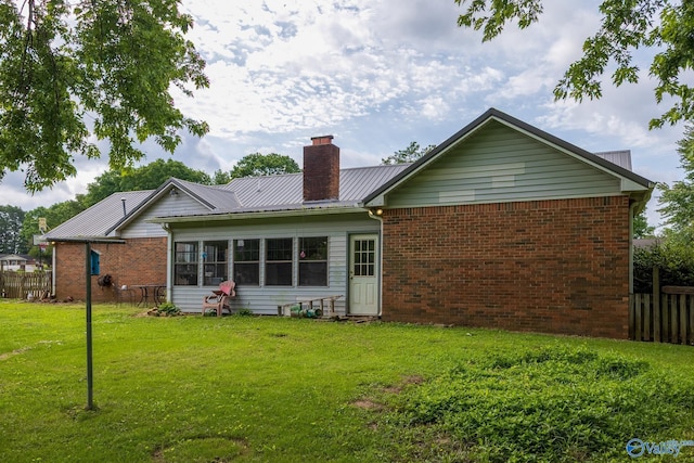 43 Terry Ln, Trinity, AL 35673 - rear view of property with a chimney, brick siding, and metal roof