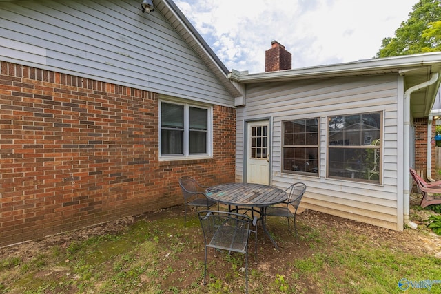 43 Terry Ln, Trinity, AL 35673 - rear view of property featuring a chimney and brick siding
