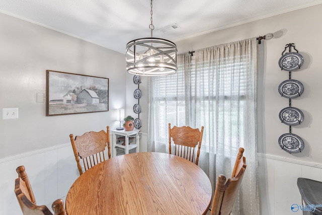 43 Terry Ln, Trinity, AL 35673 - dining space with a chandelier, a wainscoted wall, and crown molding
