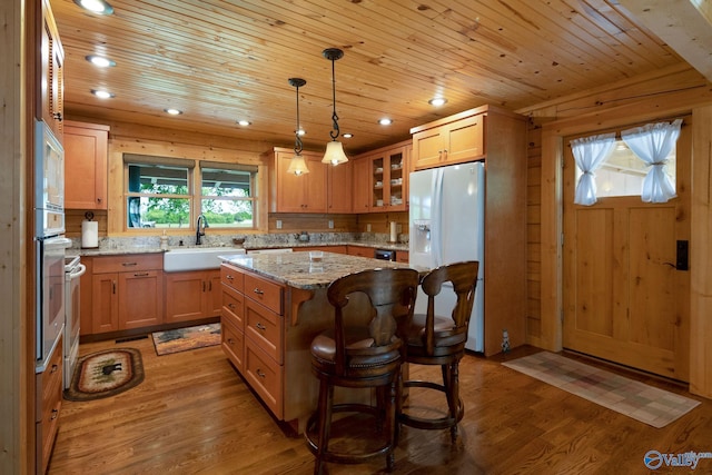 420 County Road 496, Centre, AL 35960 - kitchen with light wood-style flooring, a sink, a center island, wooden ceiling, and white appliances