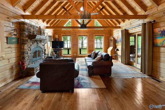 420 County Road 496, Centre, AL 35960 - living area featuring wood ceiling, wood walls, hardwood / wood-style floors, beam ceiling, and a fireplace