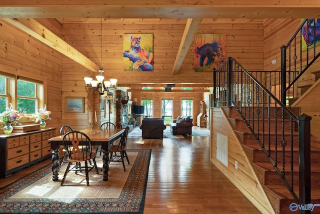 420 County Road 496, Centre, AL 35960 - dining area with stairway, a notable chandelier, wooden walls, and wood-type flooring