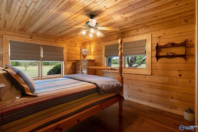 420 County Road 496, Centre, AL 35960 - bedroom featuring wooden walls and multiple windows