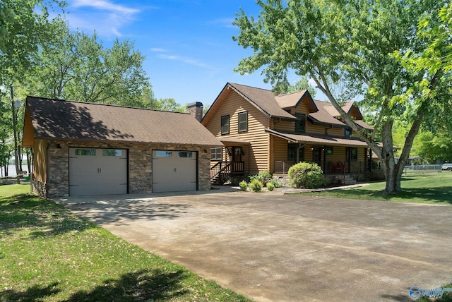 420 County Road 496, Centre, AL 35960 - view of front facade with a front lawn, covered porch, driveway, stone siding, and a chimney