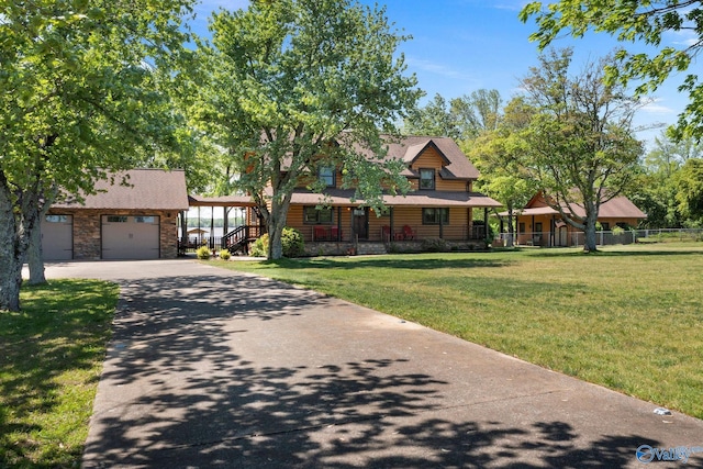 420 County Road 496, Centre, AL 35960 - view of front facade featuring covered porch, stone siding, a front lawn, concrete driveway, and an attached garage
