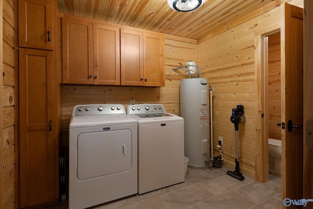 420 County Road 496, Centre, AL 35960 - clothes washing area with cabinet space, separate washer and dryer, wooden walls, water heater, and wood ceiling