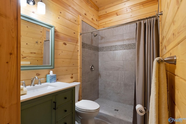 420 County Road 496, Centre, AL 35960 - bathroom featuring tiled shower, wooden walls, toilet, and vanity