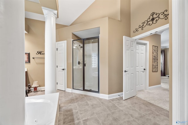 230 Knotting Pl, Madison, AL 35758 - full bath with ornate columns, a shower stall, a tub with jets, lofted ceiling, and tile patterned flooring