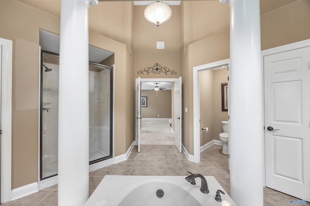 230 Knotting Pl, Madison, AL 35758 - bathroom with a towering ceiling, a stall shower, ceiling fan, tile patterned flooring, and a garden tub