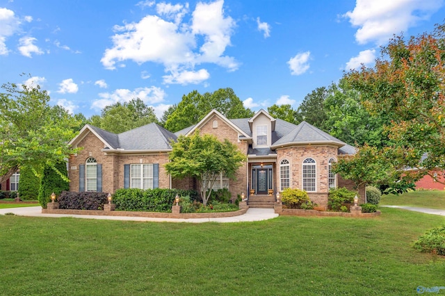 230 Knotting Pl, Madison, AL 35758 - view of front of home with brick siding and a front yard