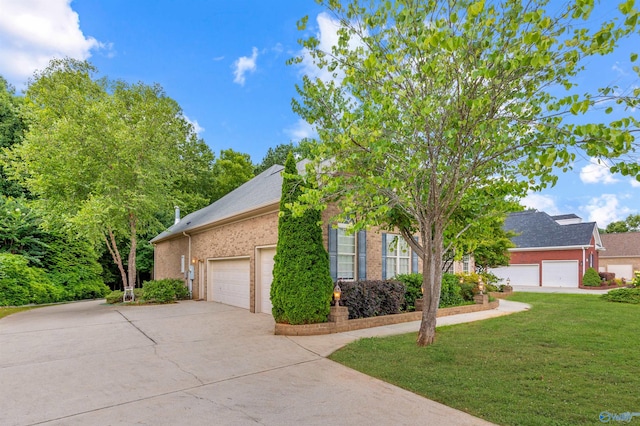 230 Knotting Pl, Madison, AL 35758 - view of front of house featuring a garage, driveway, brick siding, and a front lawn