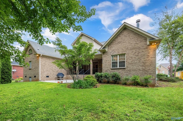 230 Knotting Pl, Madison, AL 35758 - back of house with brick siding, a lawn, and a patio