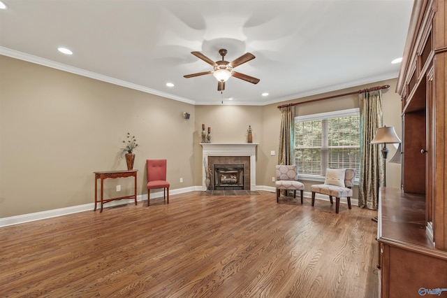 230 Knotting Pl, Madison, AL 35758 - sitting room with a ceiling fan, crown molding, wood finished floors, a fireplace, and recessed lighting