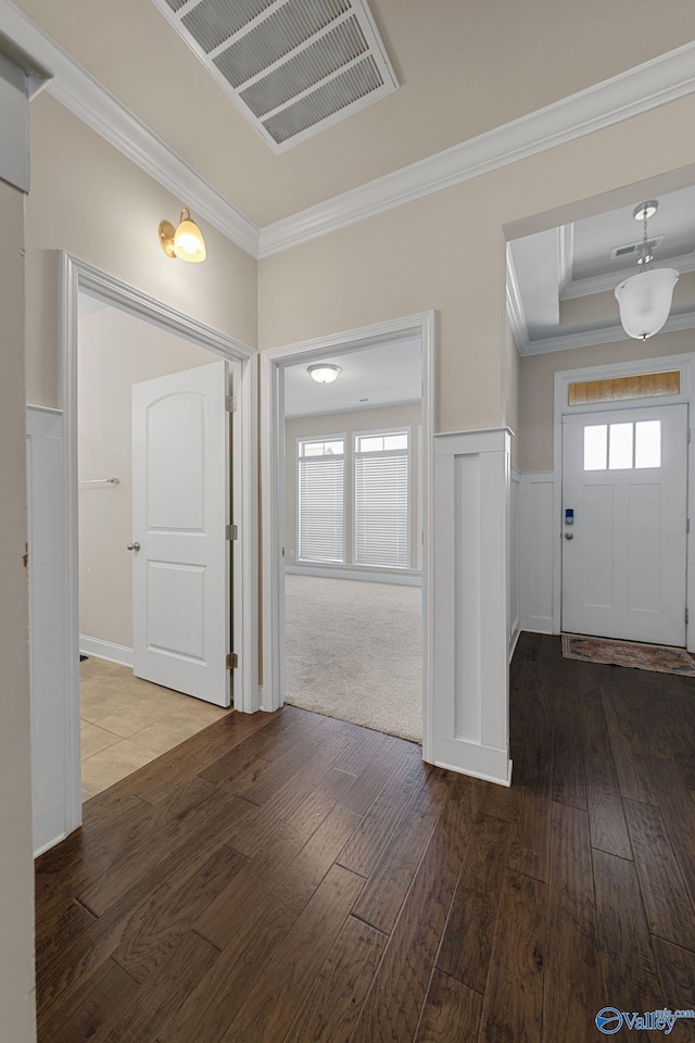 28622 Paseo Rd, Madison, AL 35756 - foyer entrance with ornamental molding, hardwood / wood-style flooring, and a wainscoted wall
