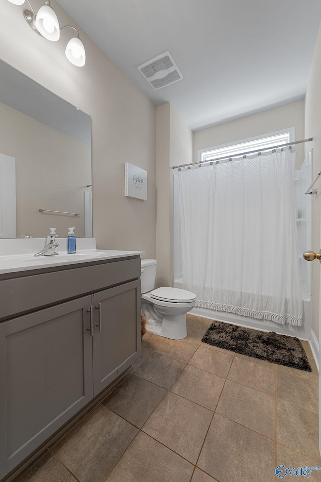 28622 Paseo Rd, Madison, AL 35756 - full bath with toilet, vanity, tile patterned flooring, and shower / bathtub combination with curtain
