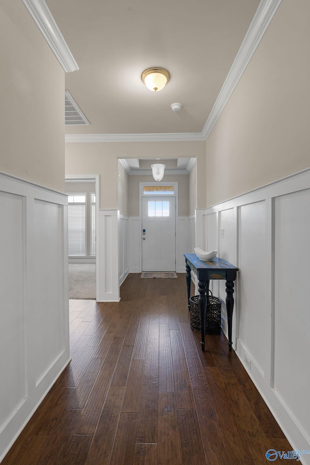 28622 Paseo Rd, Madison, AL 35756 - entryway featuring a decorative wall, dark wood-type flooring, a wainscoted wall, and crown molding