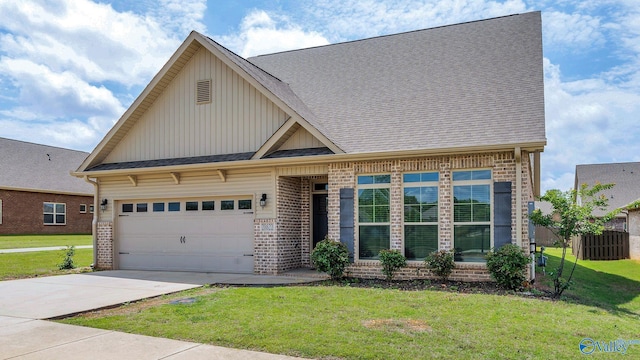 28622 Paseo Rd, Madison, AL 35756 - view of front of home with brick siding, board and batten siding, and a garage