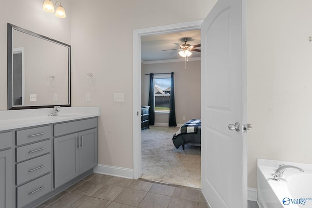 28622 Paseo Rd, Madison, AL 35756 - full bathroom with vanity, ornamental molding, baseboards, ceiling fan, and a bath