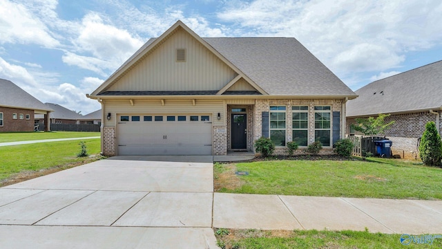 28622 Paseo Rd, Madison, AL 35756 - craftsman house featuring brick siding, a front lawn, driveway, board and batten siding, and an attached garage