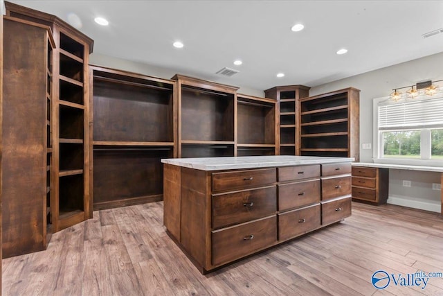 545 Pan Creek Rd, Baileyton, AL 35019 - walk in closet featuring visible vents, wood finished floors, and built in desk