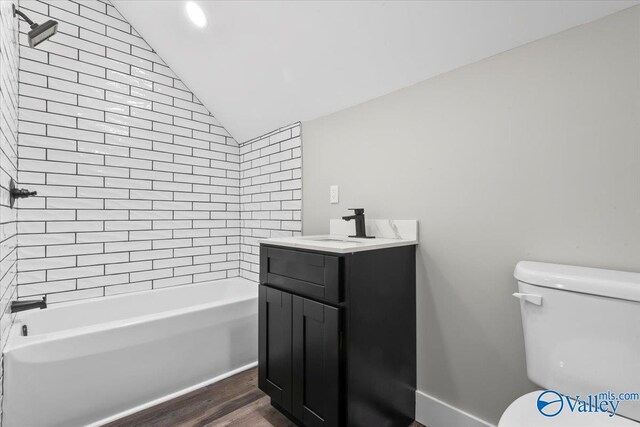 545 Pan Creek Rd, Baileyton, AL 35019 - bathroom with wood finished floors, bathing tub / shower combination, toilet, vanity, and lofted ceiling