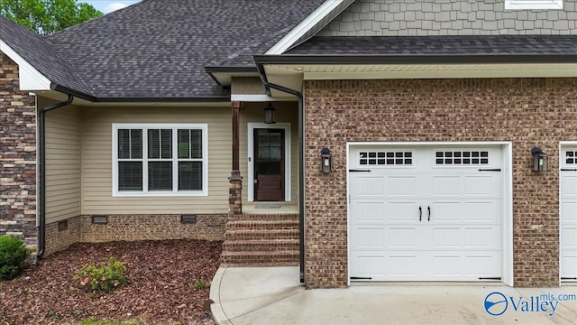 545 Pan Creek Rd, Baileyton, AL 35019 - doorway to property featuring a garage, brick siding, a shingled roof, and crawl space