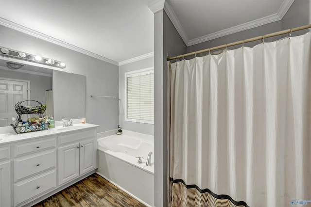 bathroom with crown molding, a washtub, vanity, and hardwood / wood-style flooring