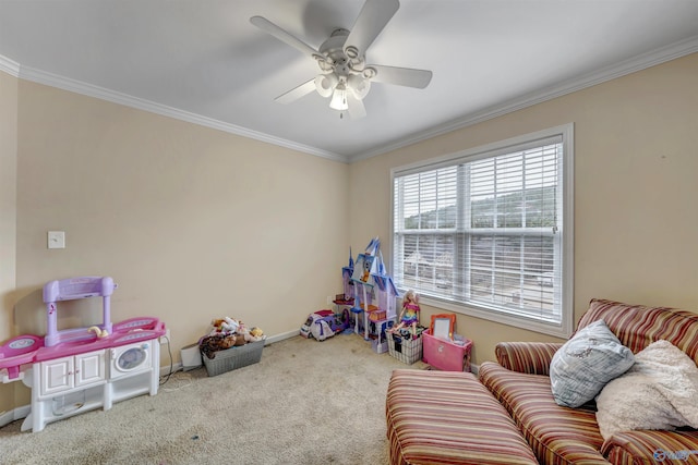 game room with ceiling fan, carpet, and ornamental molding