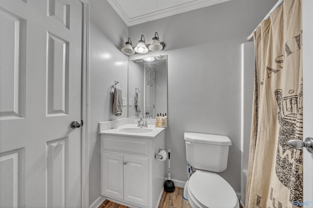 full bathroom with vanity, crown molding, hardwood / wood-style flooring, toilet, and shower / tub combo