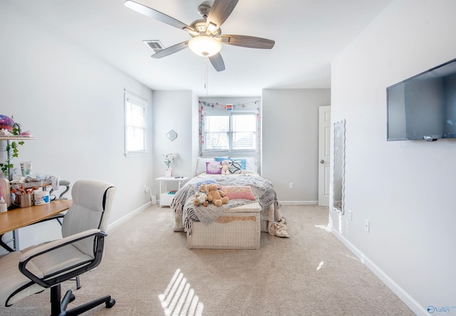 carpeted bedroom featuring visible vents, ceiling fan, and baseboards