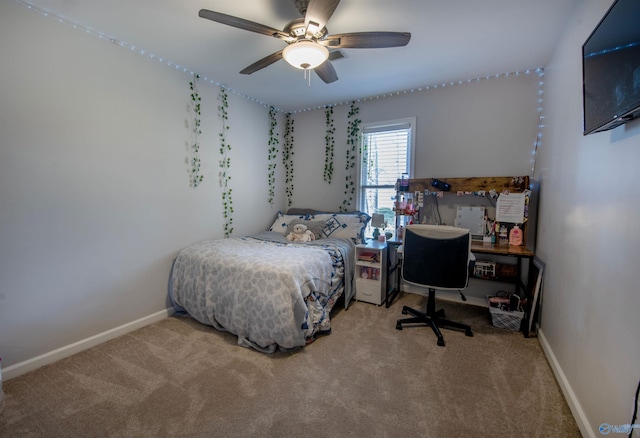 bedroom featuring ceiling fan, carpet flooring, and baseboards