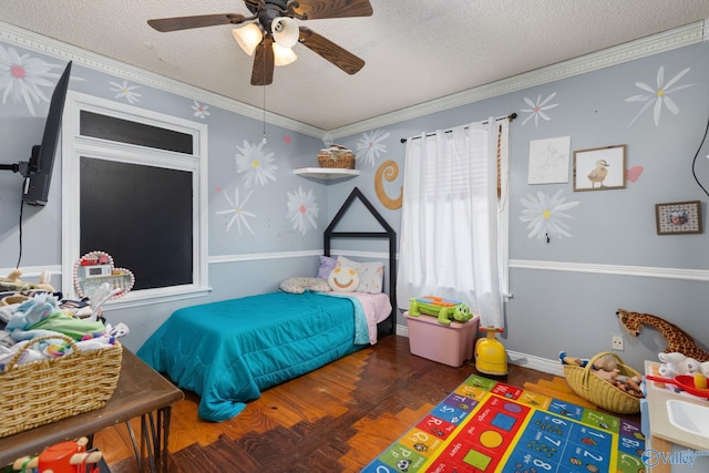 bedroom with a textured ceiling, wood finished floors, ceiling fan, and baseboards