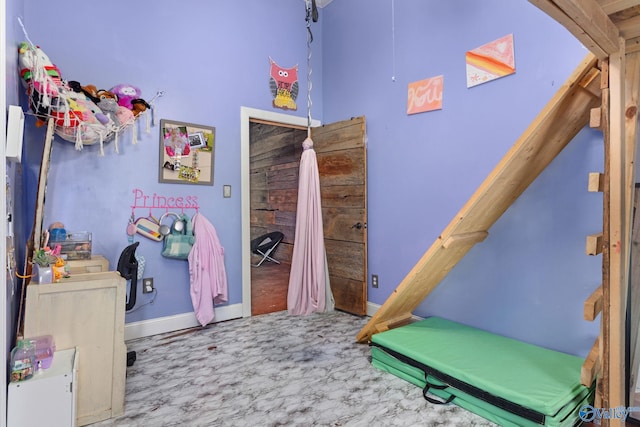 bedroom featuring baseboards