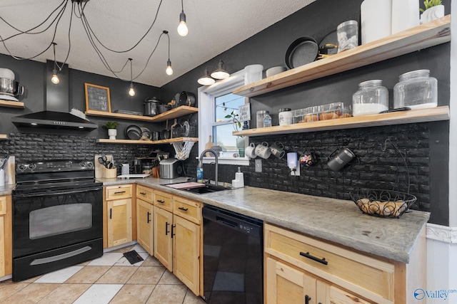 kitchen featuring open shelves, light brown cabinets, a sink, wall chimney range hood, and black appliances