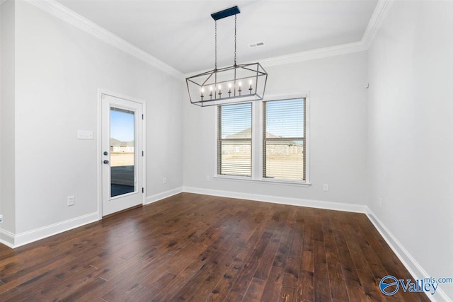 unfurnished dining area with crown molding, dark wood-type flooring, and an inviting chandelier