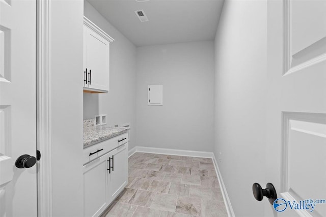 laundry area featuring cabinets and washer hookup