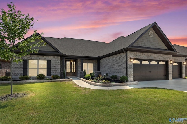 9045 Redstone Square Dr, Huntsville, AL 35824 - view of front of house with brick siding, a garage, a front lawn, and concrete driveway