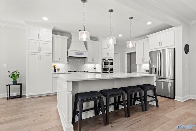 9045 Redstone Square Dr, Huntsville, AL 35824 - kitchen featuring stainless steel fridge, custom range hood, white cabinets, recessed lighting, and backsplash