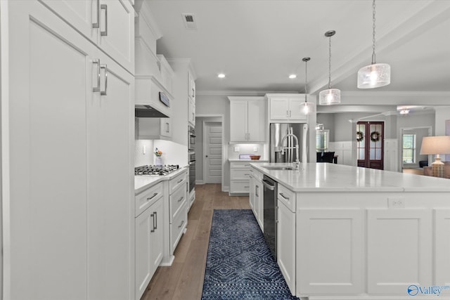 9045 Redstone Square Dr, Huntsville, AL 35824 - kitchen with light countertops, crown molding, appliances with stainless steel finishes, recessed lighting, and white cabinets