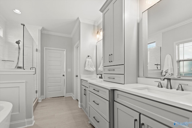 9045 Redstone Square Dr, Huntsville, AL 35824 - full bathroom with double vanity, a stall shower, ornamental molding, recessed lighting, and a freestanding tub