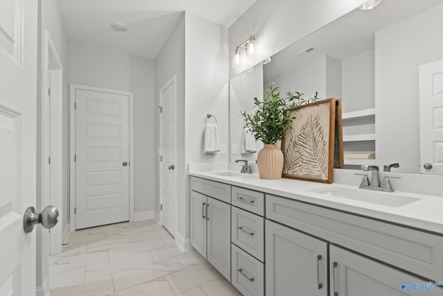 9045 Redstone Square Dr, Huntsville, AL 35824 - bathroom featuring marble look tiles and double vanity
