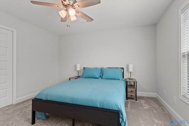 9045 Redstone Square Dr, Huntsville, AL 35824 - carpeted bedroom with baseboards and ceiling fan