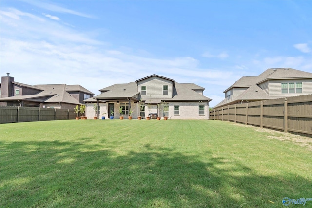 9045 Redstone Square Dr, Huntsville, AL 35824 - back of house with a fenced backyard and brick siding