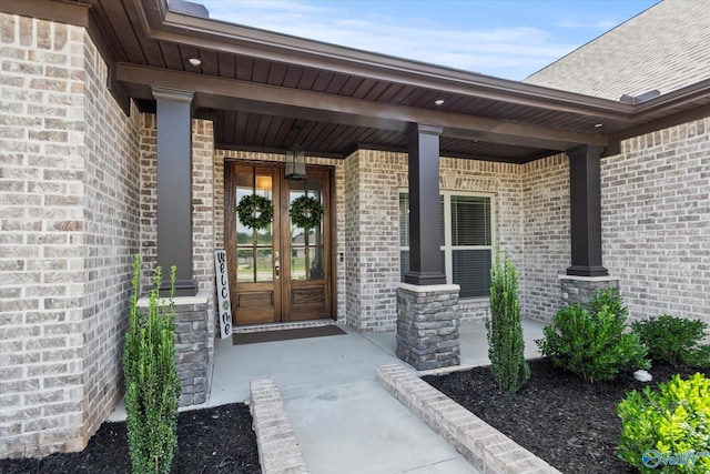 9045 Redstone Square Dr, Huntsville, AL 35824 - property entrance with brick siding, a porch, and french doors