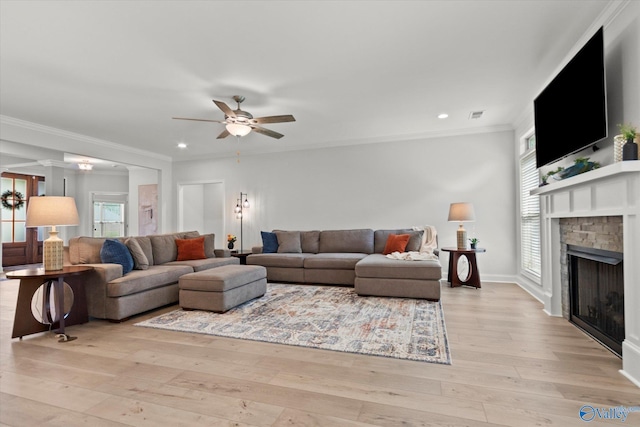 9045 Redstone Square Dr, Huntsville, AL 35824 - living area featuring a ceiling fan, light wood-type flooring, a stone fireplace, ornamental molding, and recessed lighting