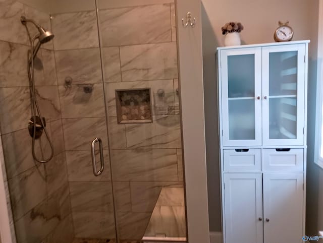 bathroom with a shower stall