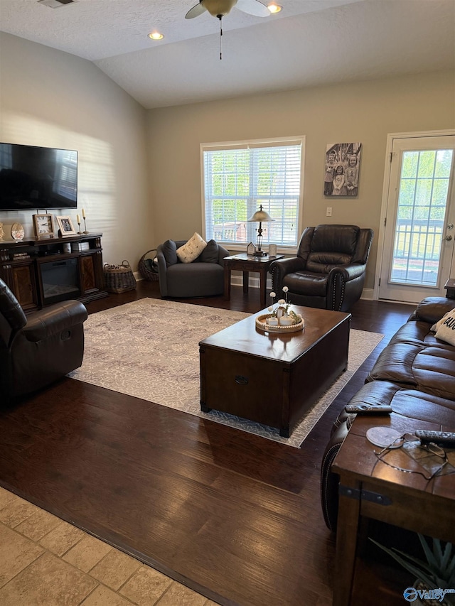 living area with visible vents, ceiling fan, recessed lighting, wood finished floors, and lofted ceiling