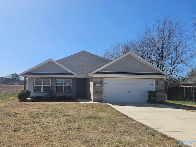 ranch-style home featuring fence, driveway, a front lawn, a garage, and brick siding