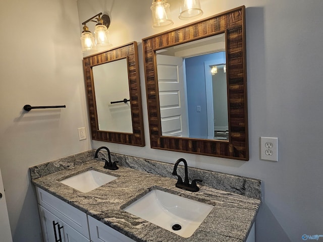 bathroom with double vanity and a sink